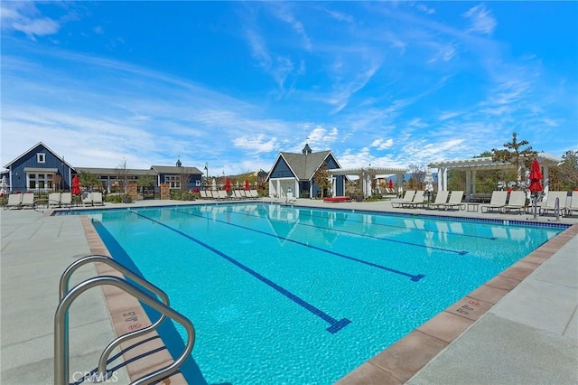 view of pool with a pergola and a patio