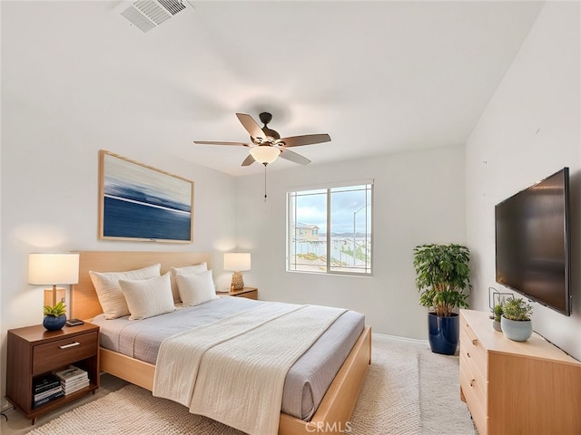 bedroom with light colored carpet and ceiling fan