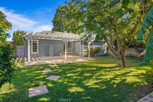 view of yard with a pergola and a patio