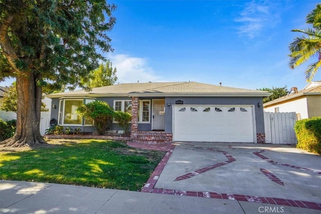 ranch-style house featuring a garage and a front lawn