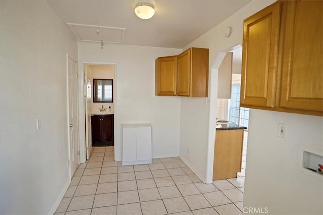 kitchen with sink and light tile patterned floors