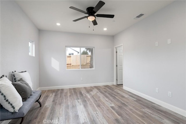 unfurnished room with ceiling fan and light hardwood / wood-style floors