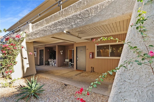 doorway to property featuring a patio area