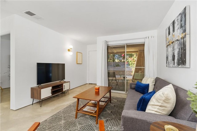 living room featuring visible vents and concrete floors