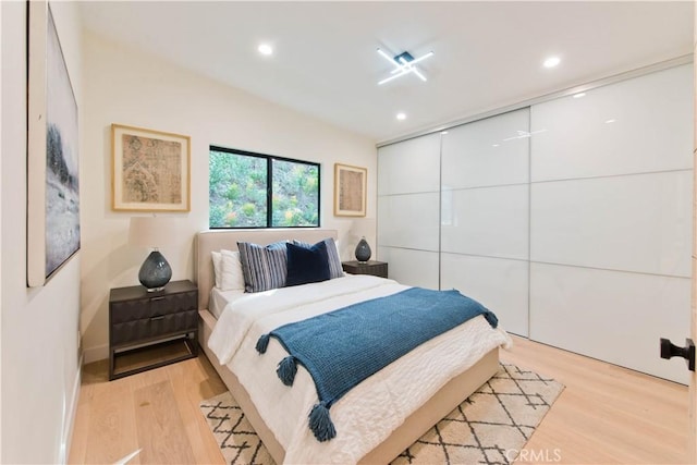 bedroom with light wood-type flooring