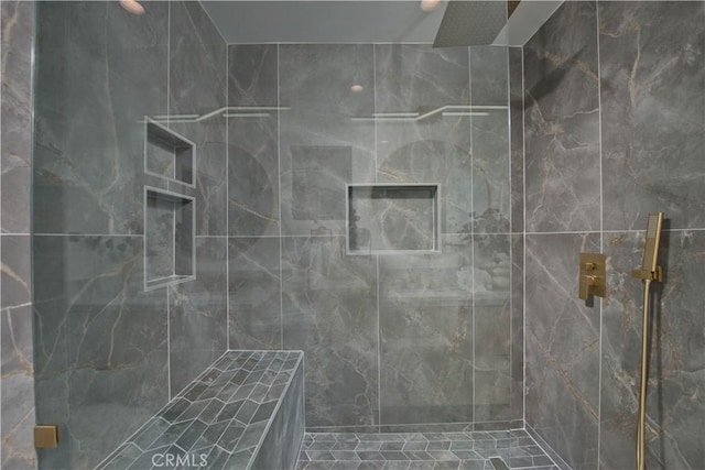 bathroom featuring tiled shower