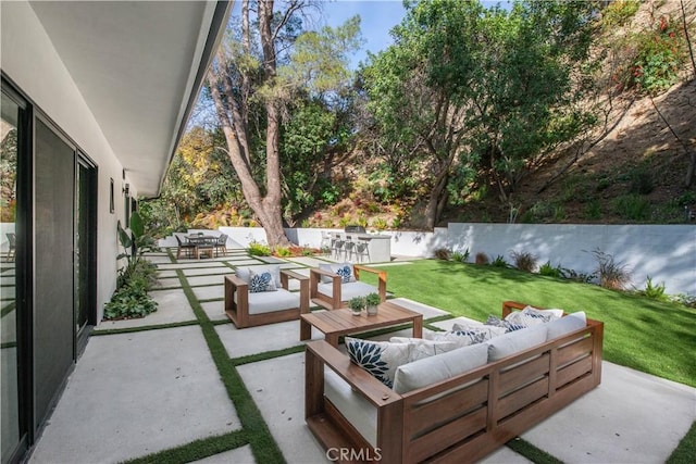 view of patio / terrace with outdoor lounge area and exterior bar