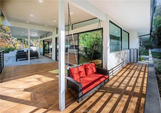 wooden deck with outdoor lounge area