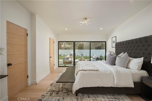 bedroom featuring access to outside and light hardwood / wood-style flooring