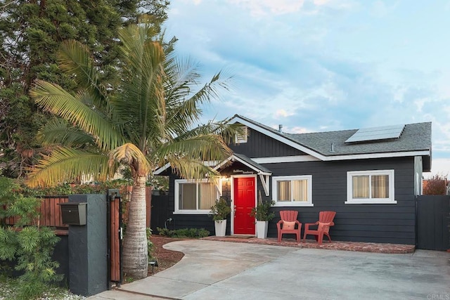 view of front of property with solar panels