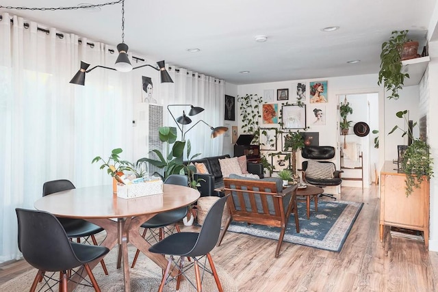 dining space with light wood-type flooring