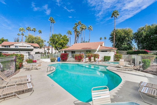 view of swimming pool featuring a patio area