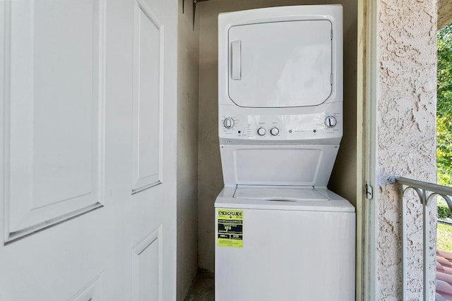 laundry room featuring stacked washing maching and dryer