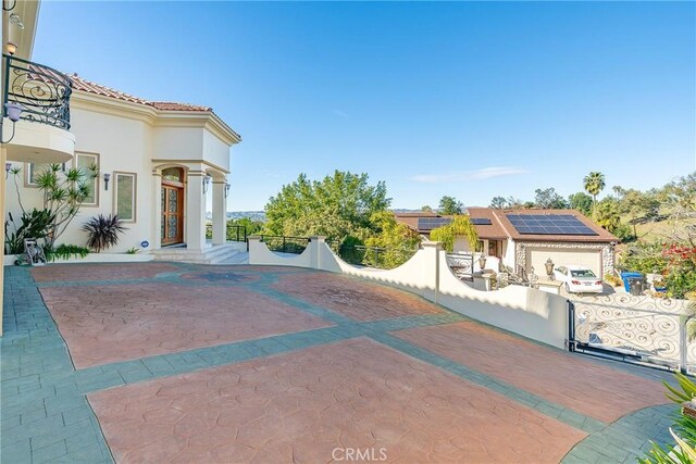 exterior space featuring a gate and fence private yard