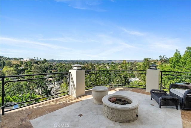 view of patio featuring an outdoor fire pit