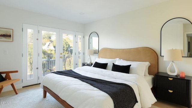 bedroom featuring multiple windows and access to outside