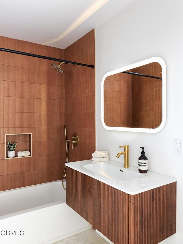 bathroom with vanity and tiled shower / bath combo