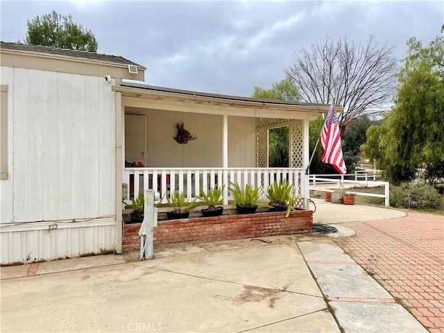 doorway to property with covered porch