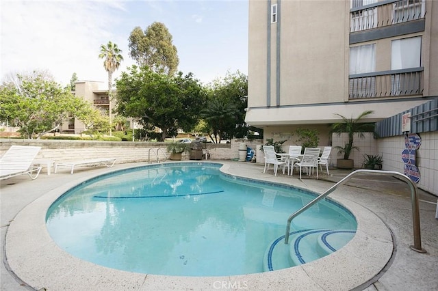 view of pool featuring a patio area