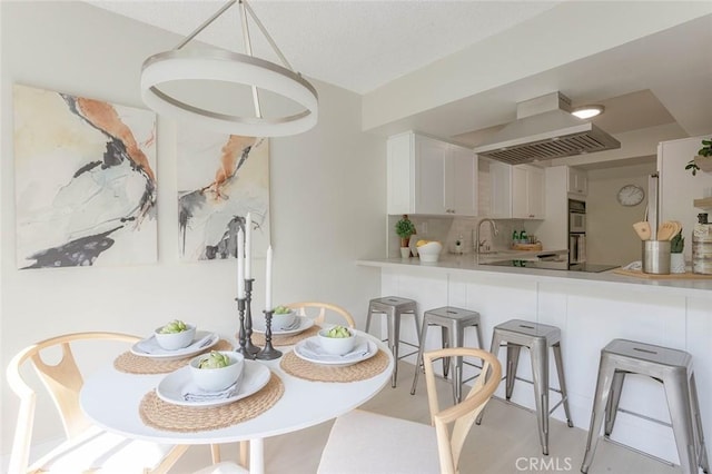 dining area featuring sink