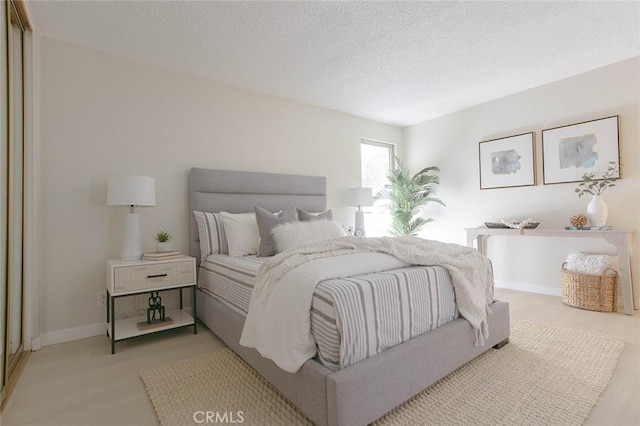 bedroom featuring a textured ceiling