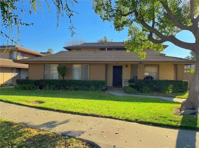 ranch-style house with a front yard