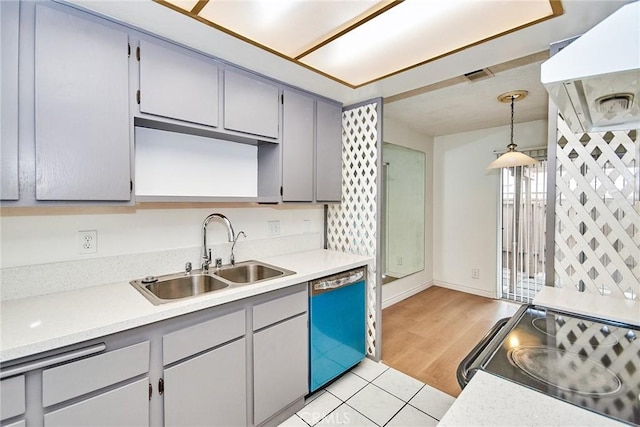 kitchen featuring appliances with stainless steel finishes, sink, exhaust hood, light wood-type flooring, and hanging light fixtures