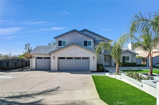 front of property featuring a garage and a front lawn