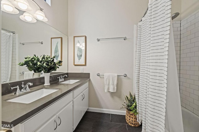 bathroom featuring tile patterned flooring and vanity