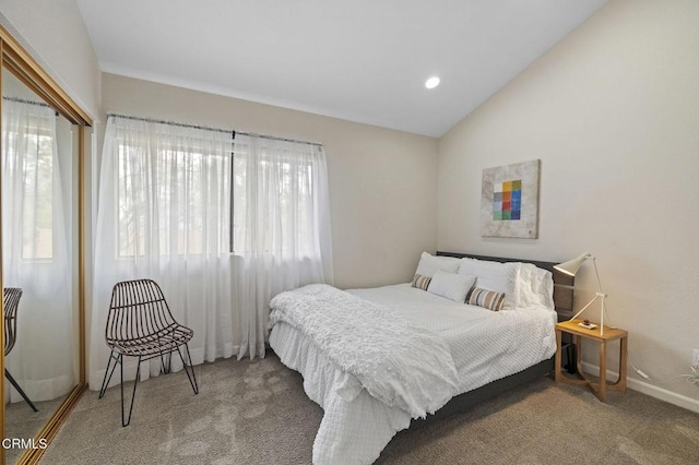 carpeted bedroom featuring vaulted ceiling