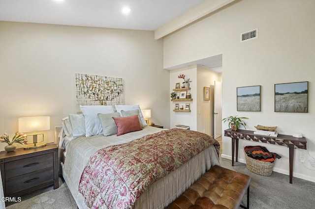 bedroom featuring lofted ceiling with beams and carpet