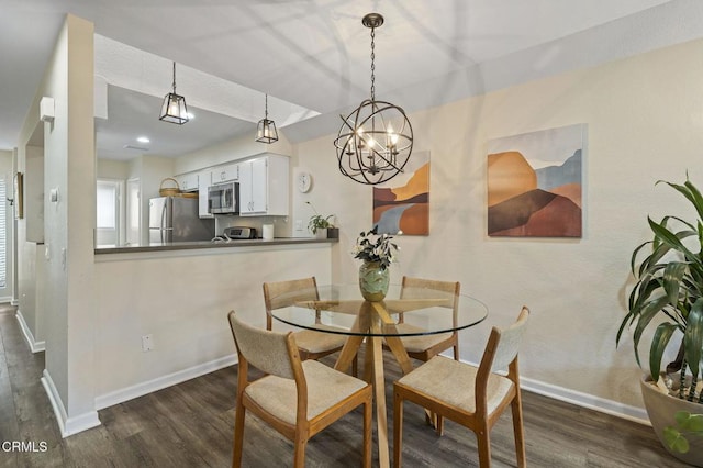 dining room with dark hardwood / wood-style floors