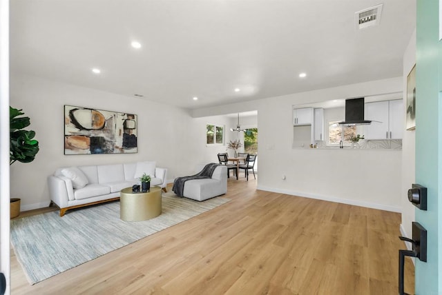 living room with light hardwood / wood-style floors