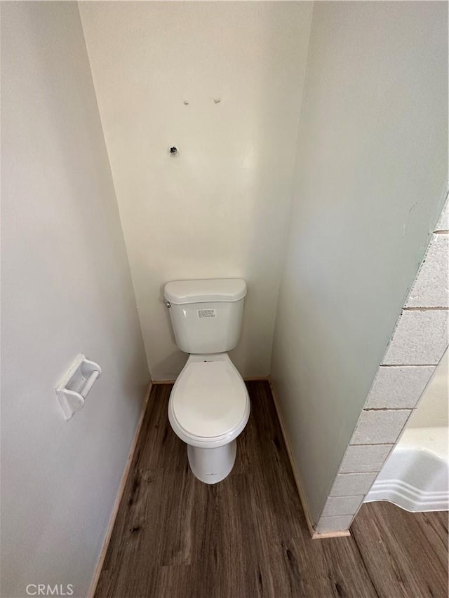 bathroom featuring toilet and hardwood / wood-style floors