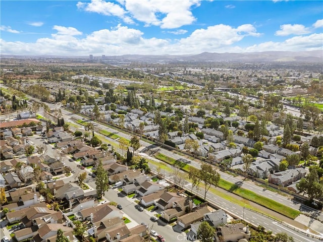 birds eye view of property with a residential view and a mountain view