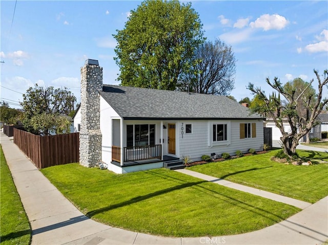 ranch-style home featuring a front yard and a porch