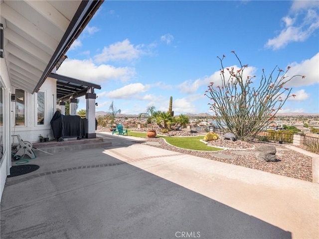 view of patio featuring fence