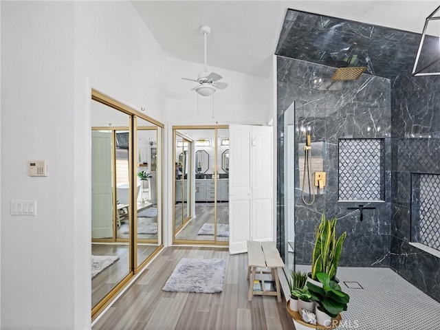 interior space with ceiling fan and wood finished floors