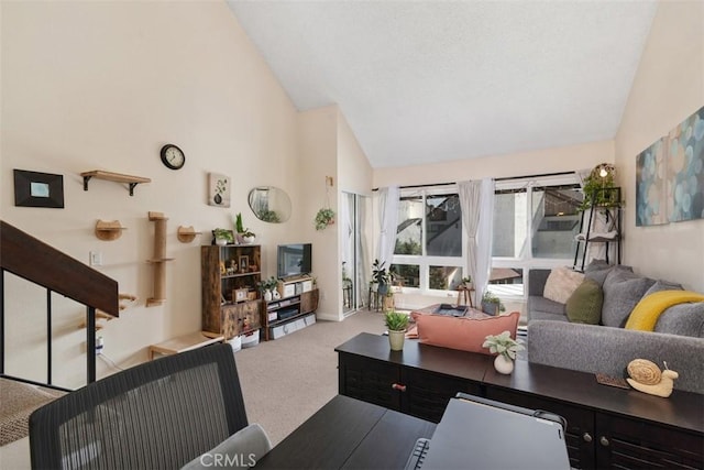 living room with light carpet and high vaulted ceiling