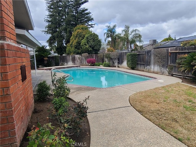 view of swimming pool featuring a patio, a fenced backyard, and a fenced in pool