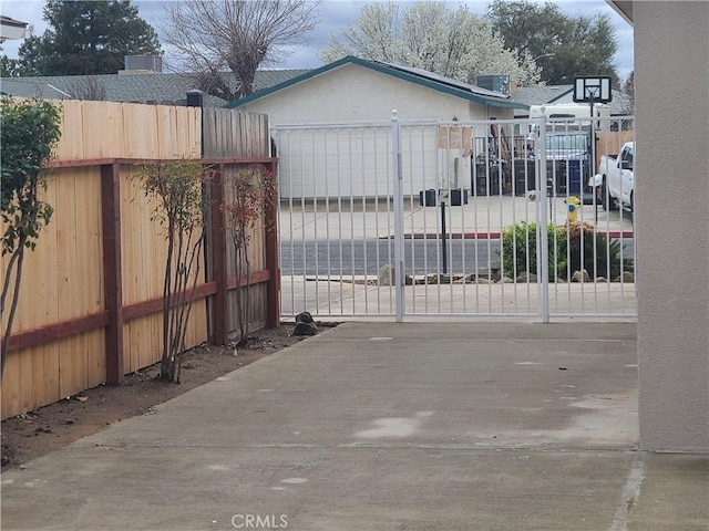 view of gate with fence