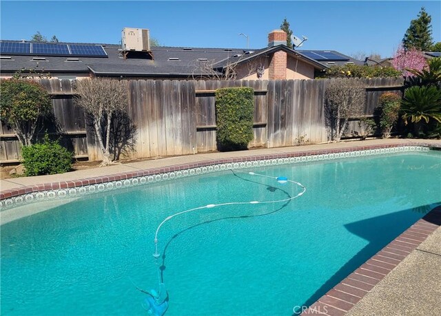 view of swimming pool with a fenced in pool and a fenced backyard