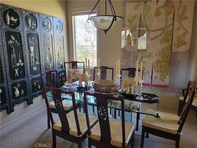 view of carpeted dining area