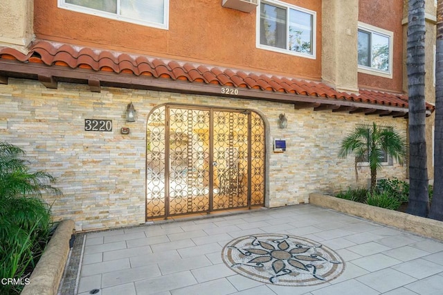 doorway to property featuring a patio