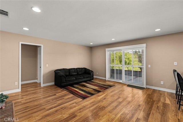 living room with hardwood / wood-style flooring