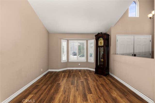 unfurnished room with dark hardwood / wood-style floors