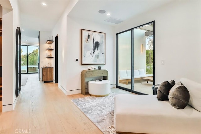 bedroom featuring light wood-type flooring and access to outside