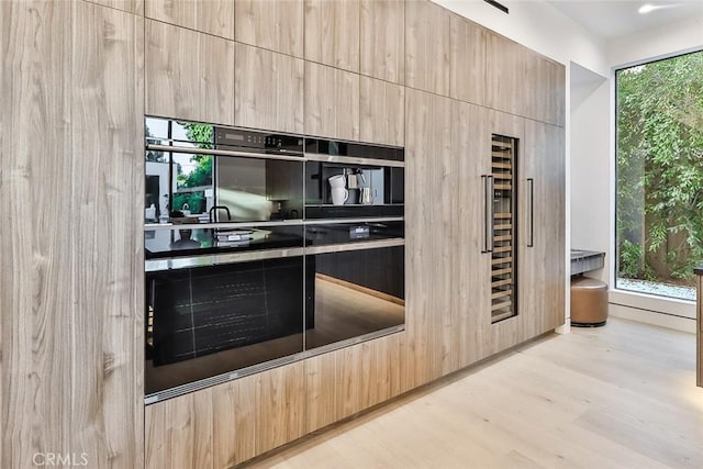 kitchen featuring light brown cabinets and light wood-type flooring