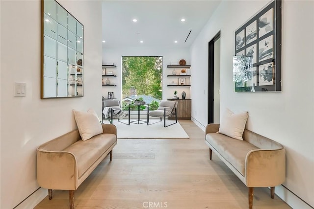 living area with light hardwood / wood-style flooring