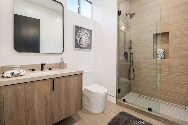 bathroom featuring walk in shower, vanity, toilet, and tile patterned flooring